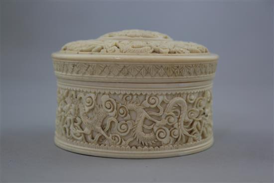 A Chinese ivory dragon drum shaped box and cover, early 20th century, diam. 10.5cm